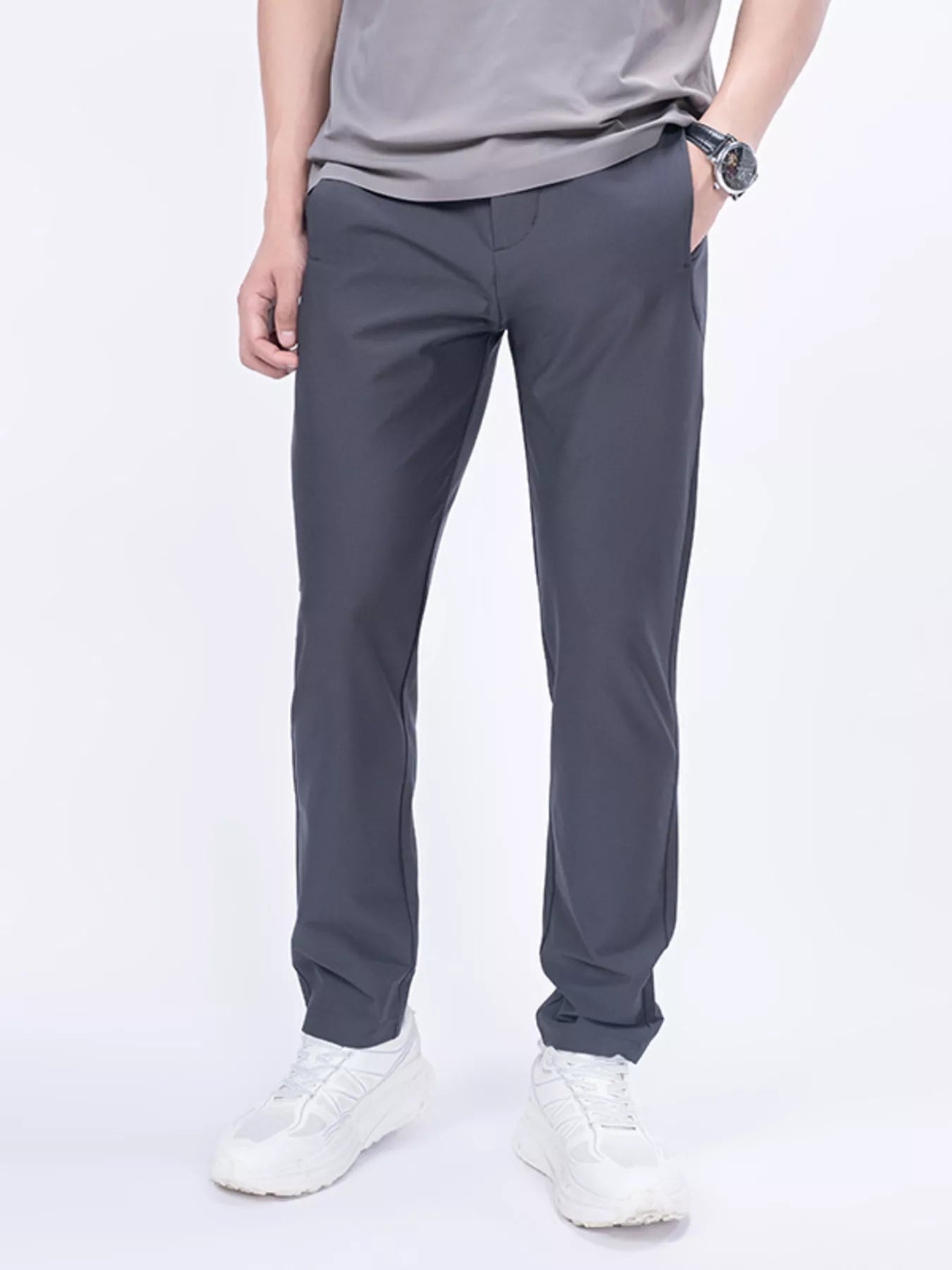 Men's dark gray slim-fit casual pants with pockets, available in plus sizes.