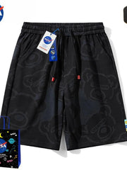 Men's black bear-print shorts with a drawstring waist and pockets.