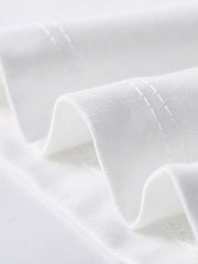 Close-up of white children's t-shirt sleeve hem stitching and smooth folded fabric