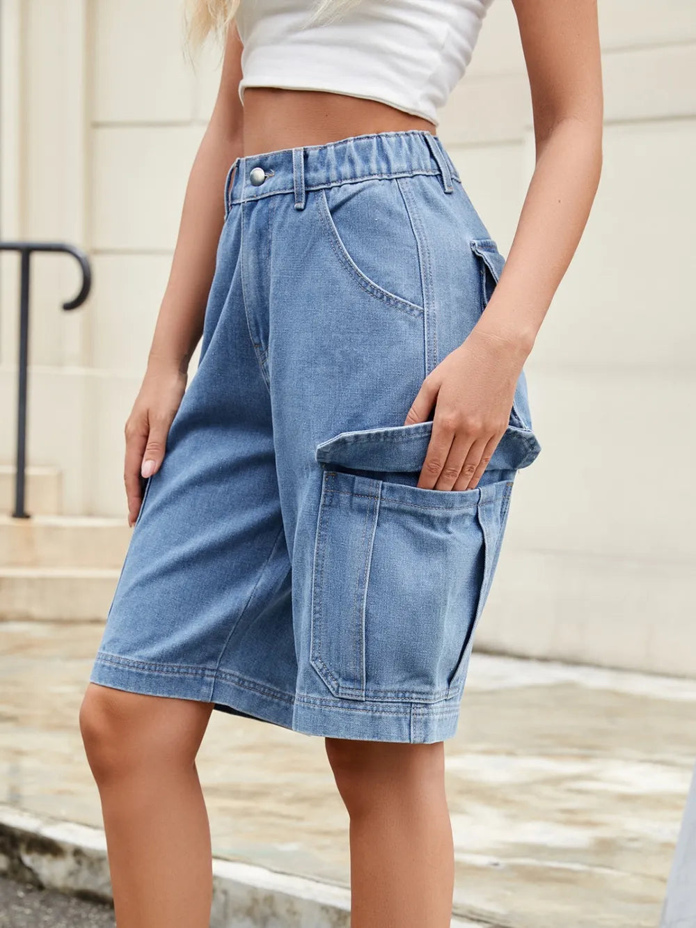Women's high-waist denim shorts with pockets in a rayon-polyester blend.