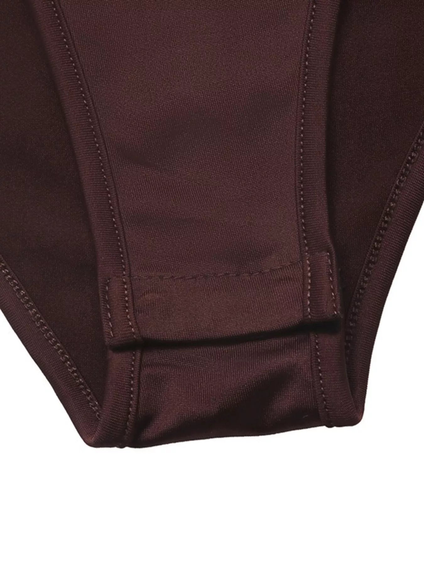 Close-up of the coffee brown bodysuit solid bottom closure and stitching