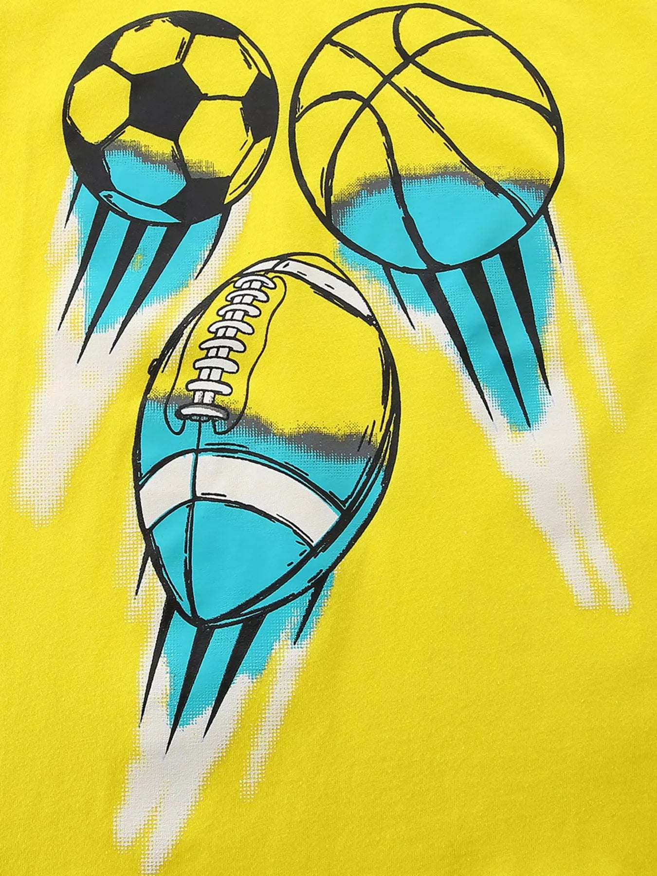 Close up of soccer basketball and football graphics with blue motion streaks on canary yellow children's t-shirt