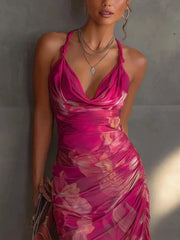 Close up of the rose red floral halter dress bodice with draped cowl neckline and ruched waist