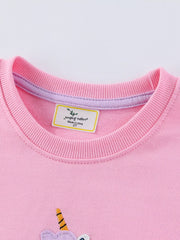 Close view of the ribbed crew neckline on a pink children's sweatshirt