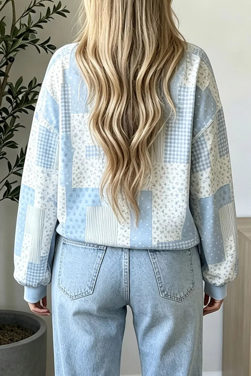 Back view of light blue vintage patchwork dropped shoulder sweatshirt with floral and gingham panels