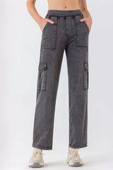 Women's long washed jeans with buttons, pockets, and moderate stretch.