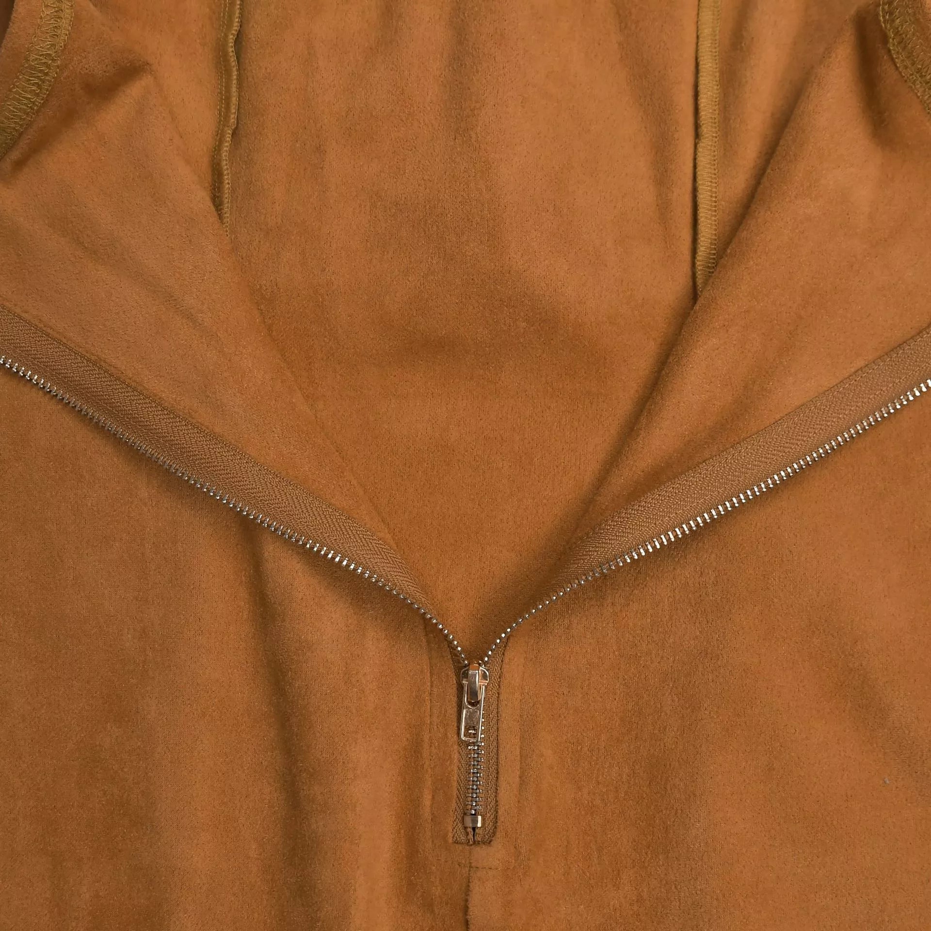 Caramel strapless bodycon dress back close up showing V shaped zipper and suede texture