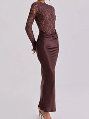Dark red long sleeve lace bodice and satin skirt maxi dress, side view on model