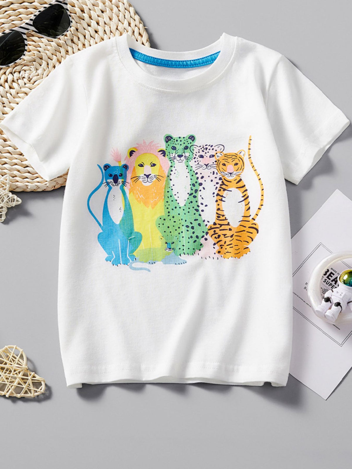 White children's casual T-shirt with a colorful graphic of a lion, cheetah, leopard and tiger