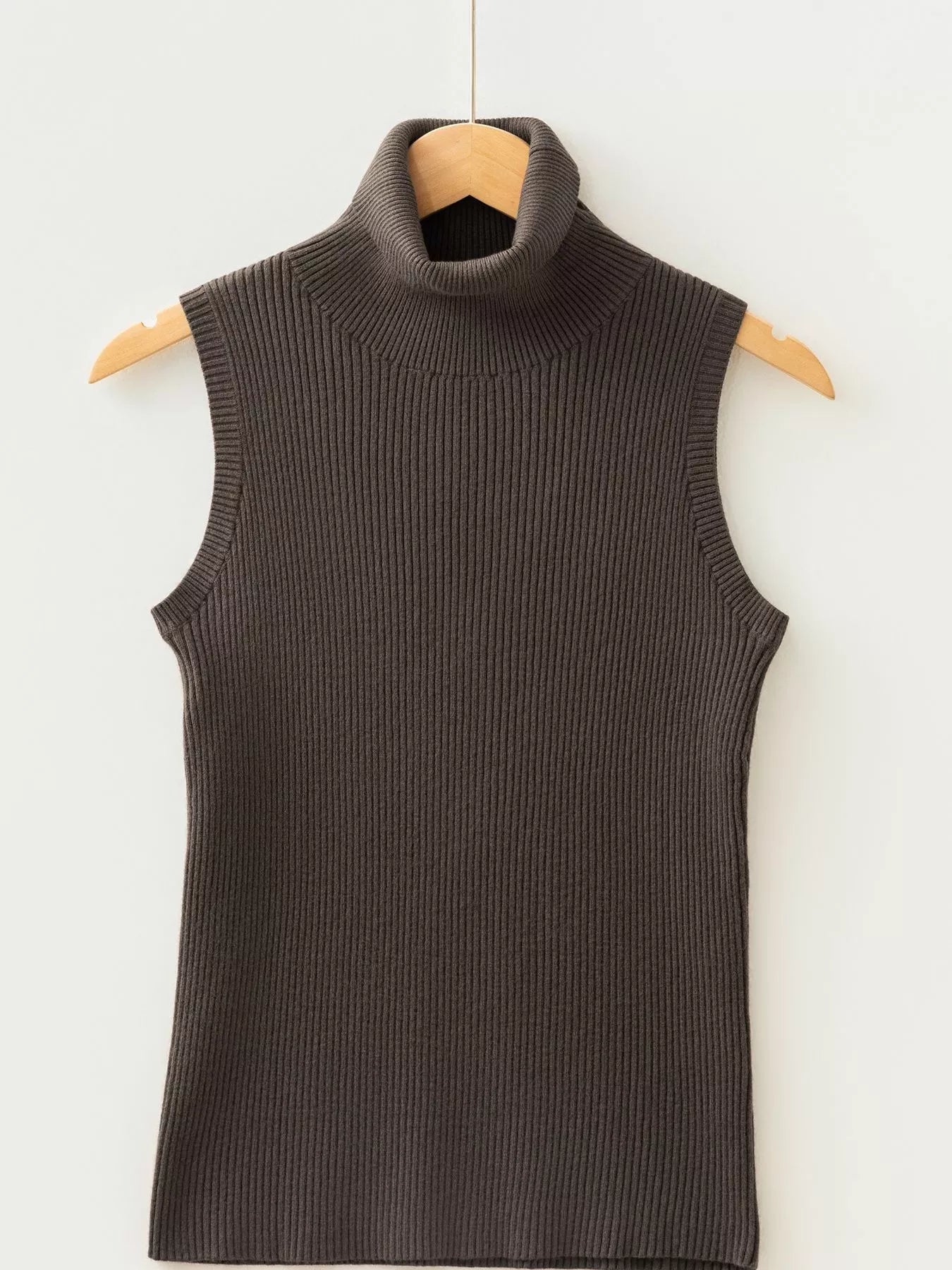 Coffee brown ribbed high neck sweater vest hanging on wooden hanger front view
