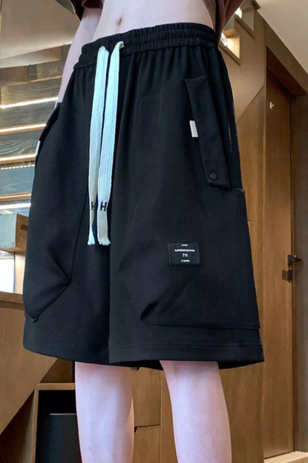 Men's lightweight shorts with a drawstring waist and pockets.