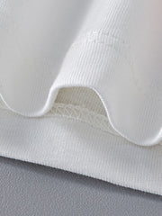 Close view of the hem stitching and white fabric on the children's unicorn tee