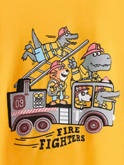 Close view of the cartoon firefighter animals and fire truck graphic on the gold children's tee