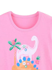 Close-up of the pink children's t-shirt neckline above a white dinosaur graphic