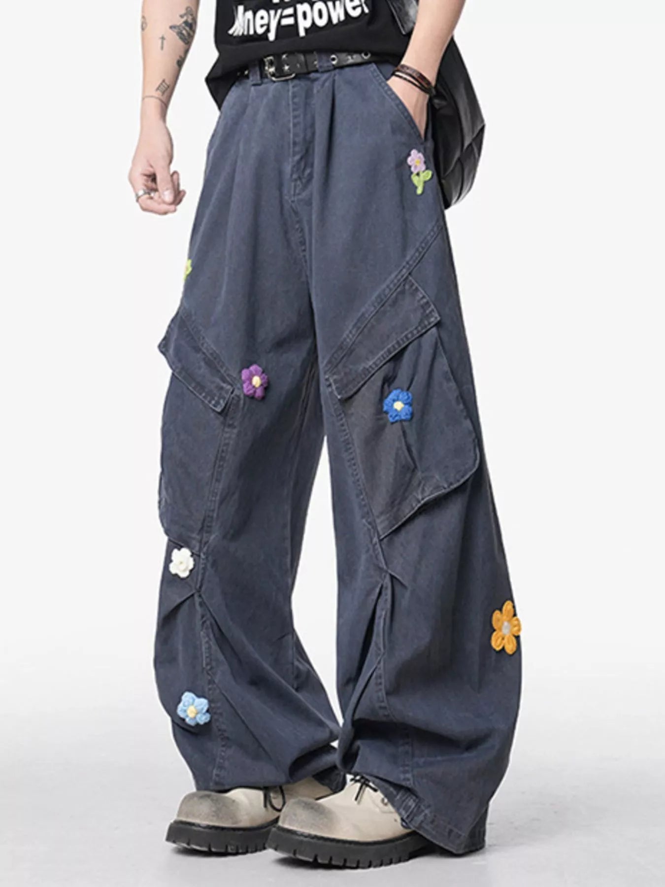 Men's grey wide-leg pants with an oversized fit and pockets.