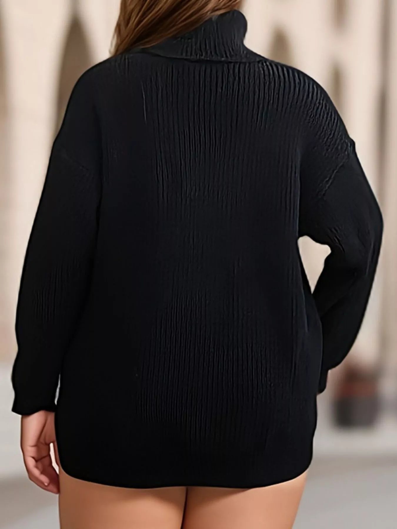 Back view of black ribbed turtleneck sweater with long sleeves