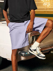 Men's casual loose fit shorts with a drawstring waist and pockets.