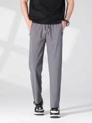 Men's light gray lightweight casual pants with a drawstring waist and pockets.