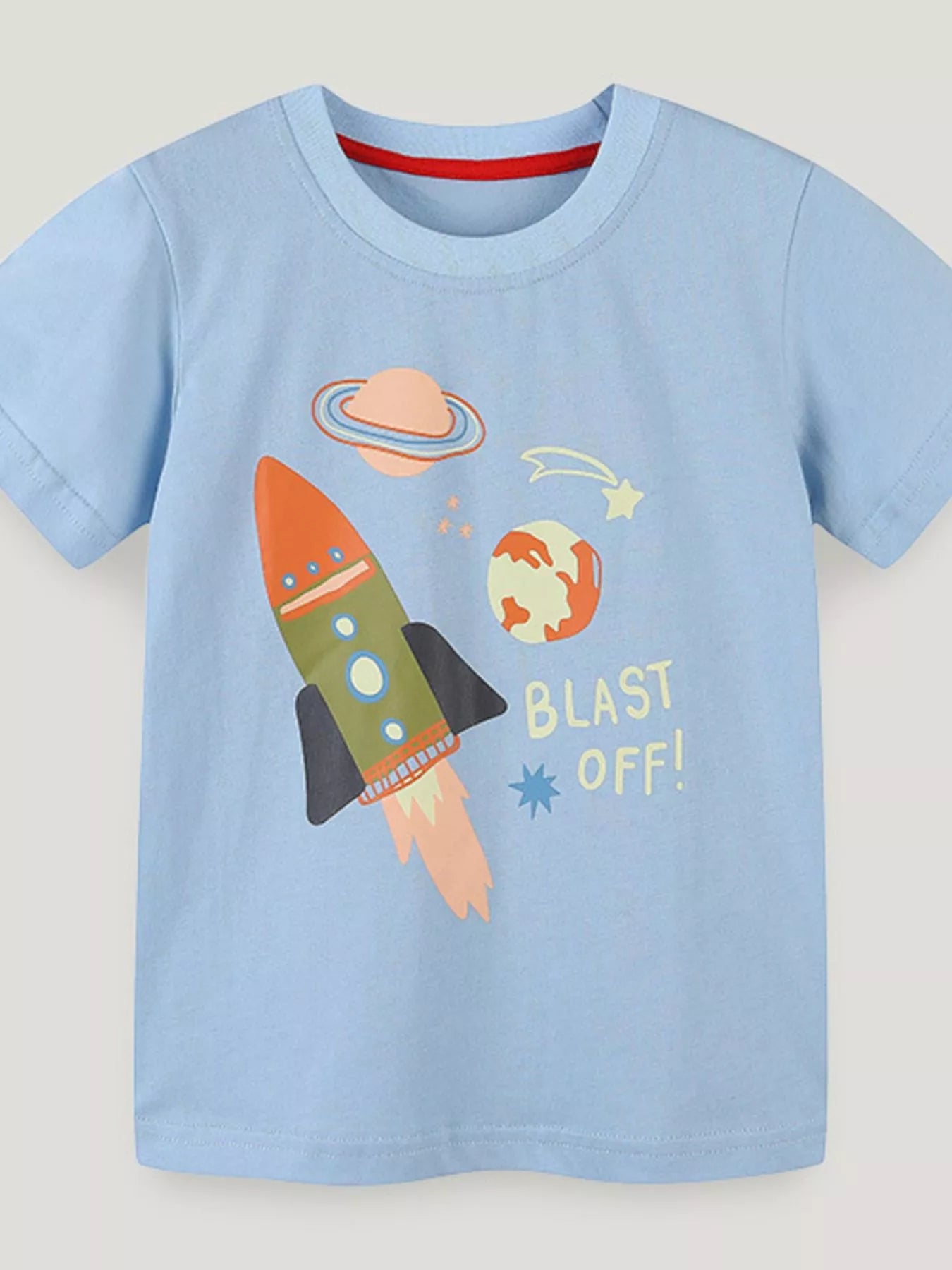 Light blue children's round neck tee with a rocket, ringed planet, and stars