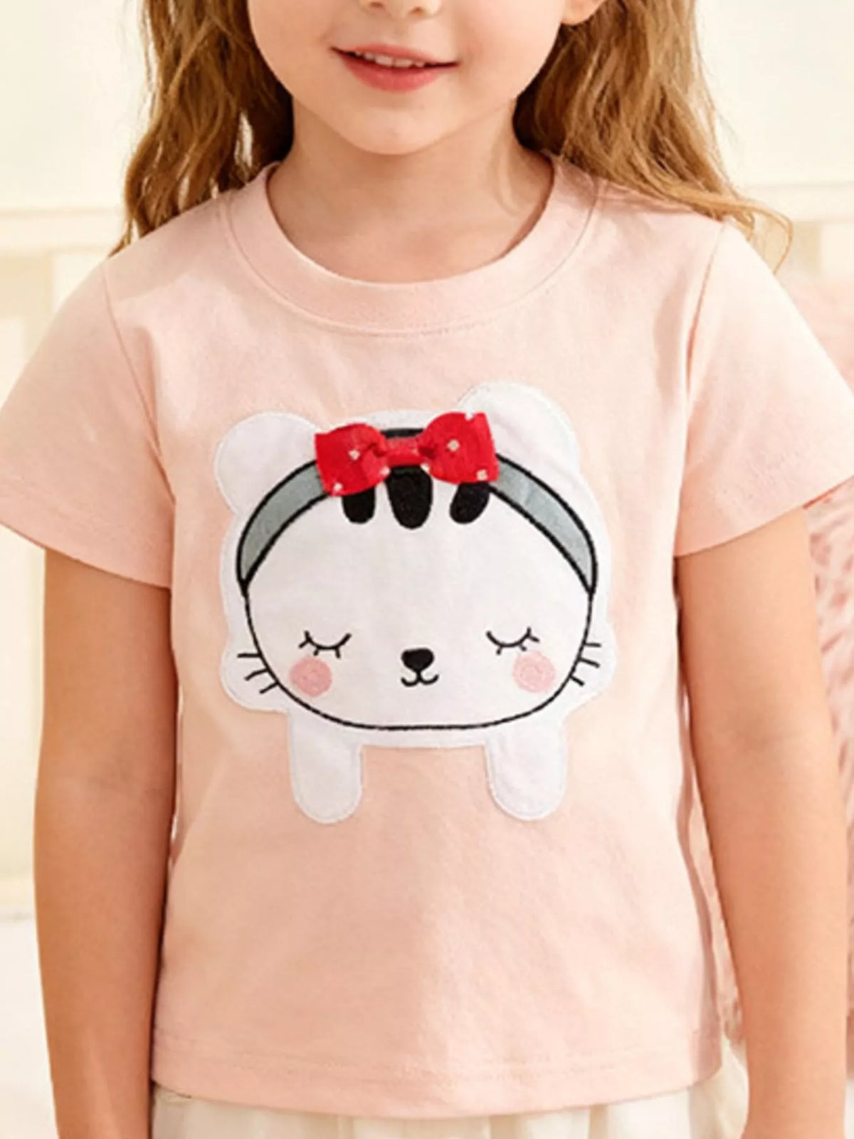Children's short-sleeve T-shirt featuring a cartoon cat graphic design.