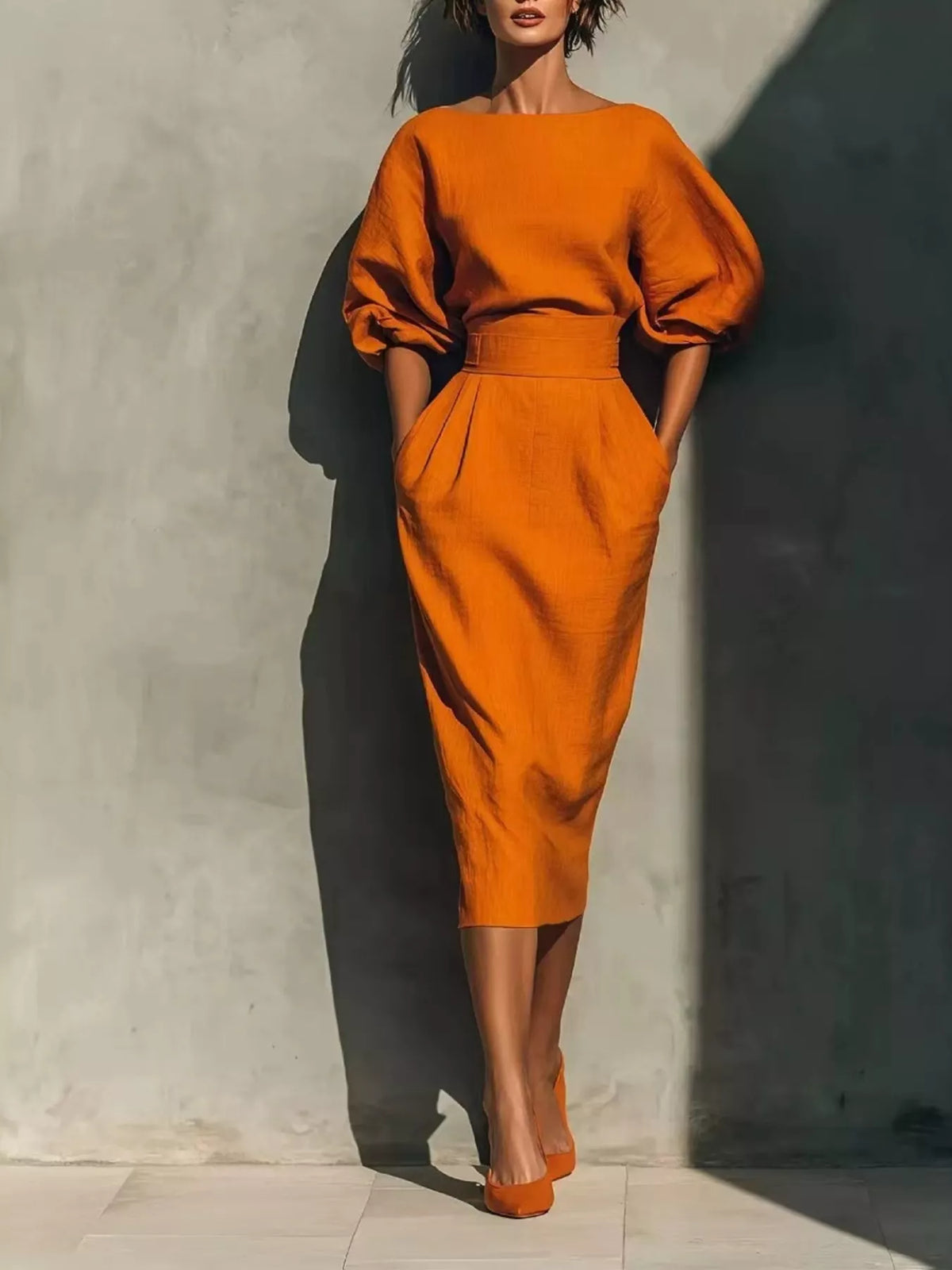 Orange round neck puff sleeve midi dress with wide waistband front view