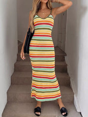 Front view of multicolor striped bodycon knit midi dress with bag over the shoulder