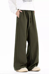 Men's wide leg casual pants with a drawstring waist and pockets.