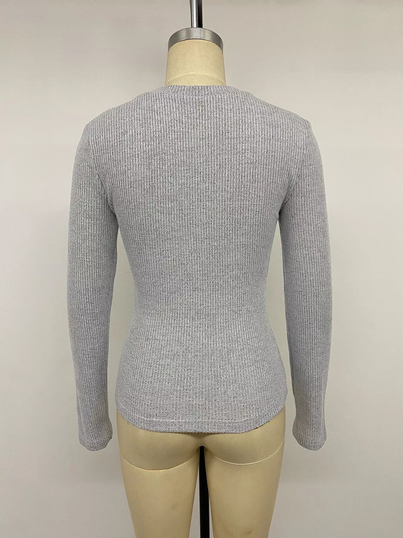 Back view of gray ribbed long-sleeve henley T-shirt with lace-trimmed neckline visible at the collar