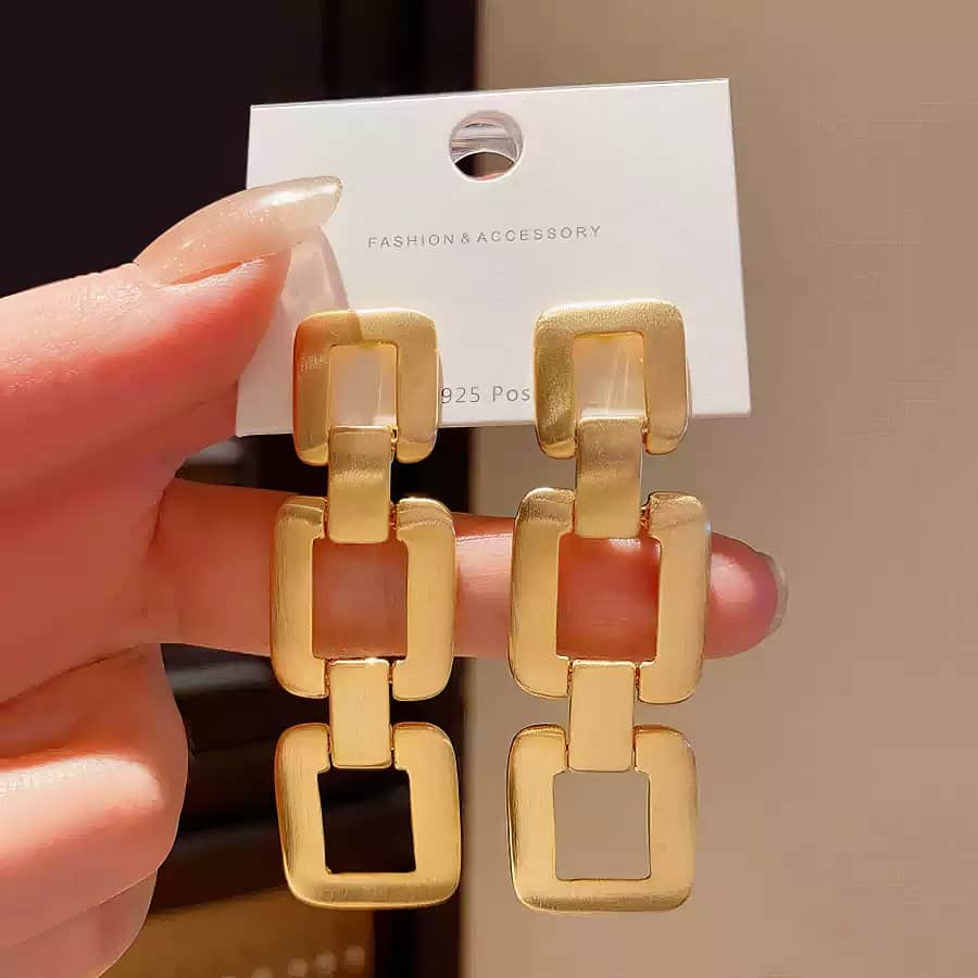 Contemporary Gold Tone Drop Earrings with Interlocking Geometric Links Gold