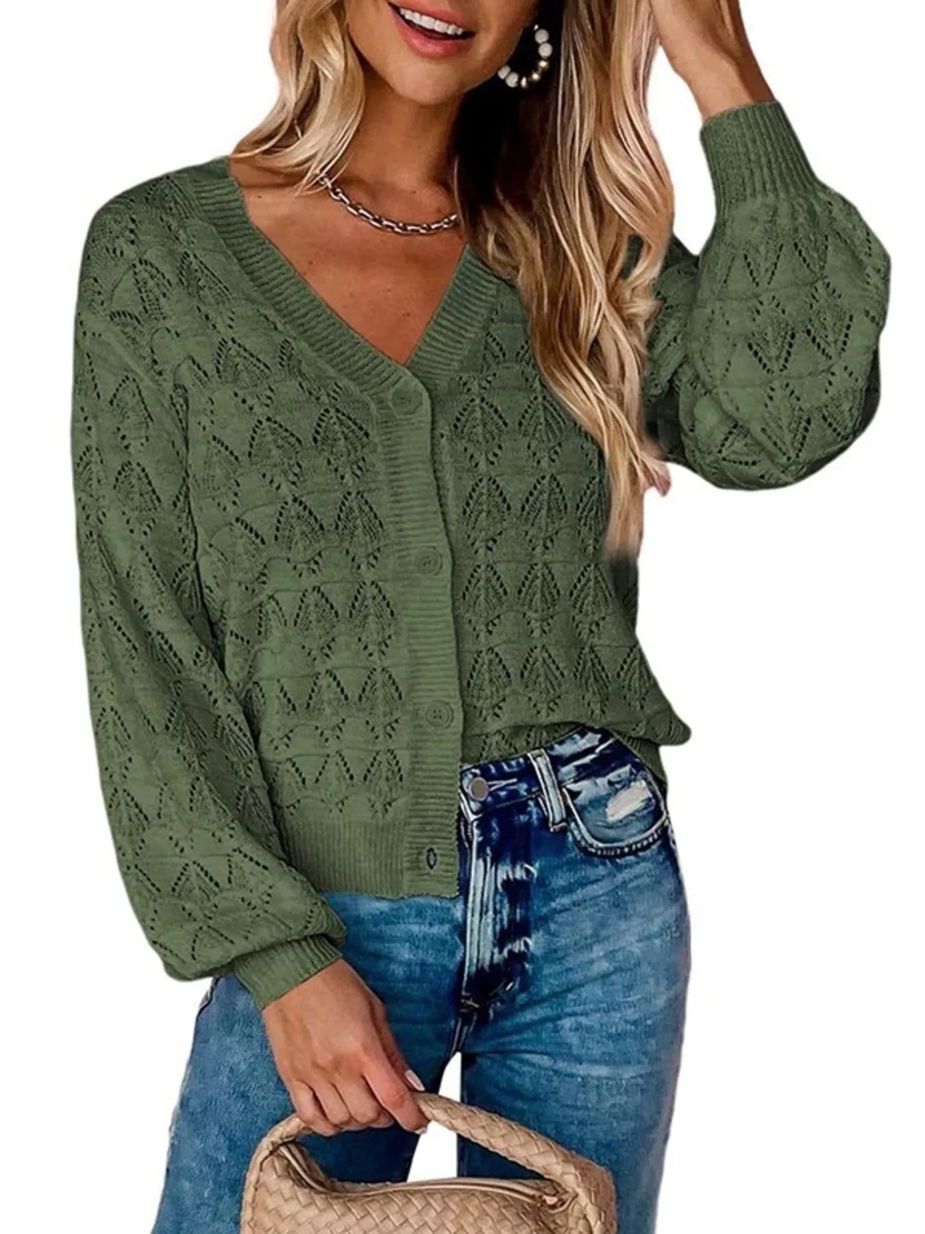 Front view of green openwork leaf knit cardigan with V neck and button front.
