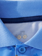 Close view of the polo collar button and inner trim on the blue children's polo shirt