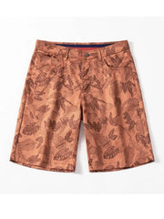 Men's ruby red printed loose fit shorts with pockets.