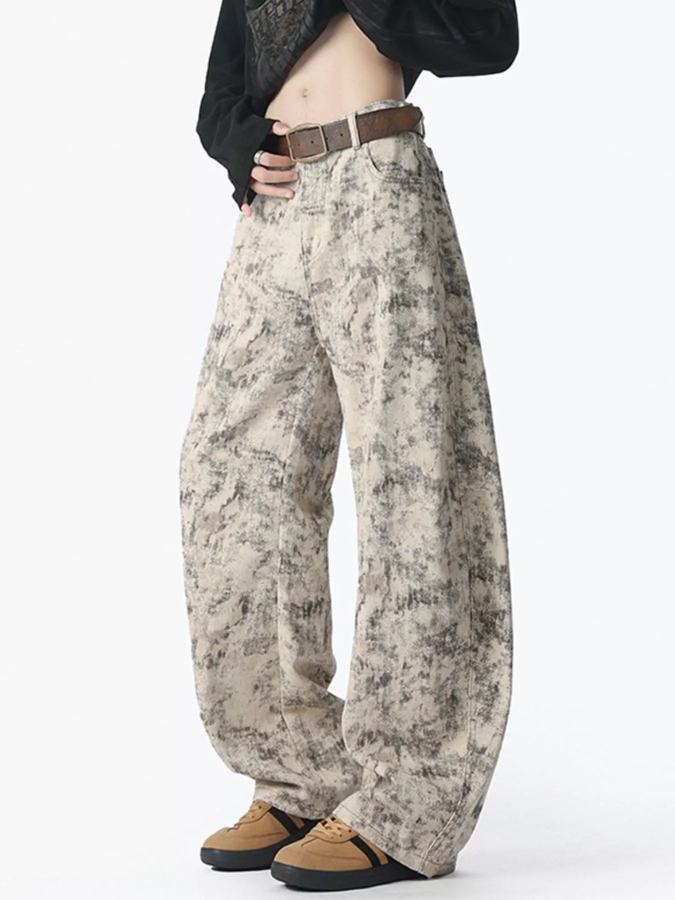 Men's washed jeans with a wide leg silhouette.