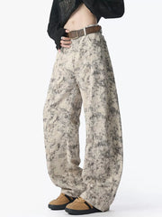 Men's washed jeans with a wide leg silhouette.