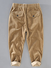 Men's pleated corduroy casual pants with pockets.