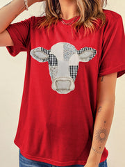Front studio view of deep red round neck casual top with patchwork cow print