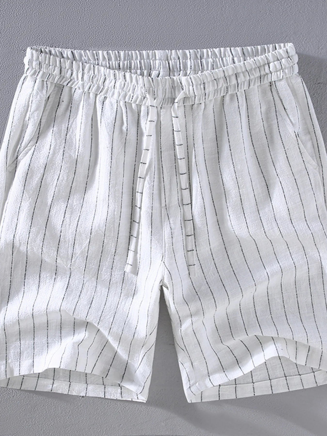 Men's white striped shorts with a drawstring waist, available in plus sizes.
