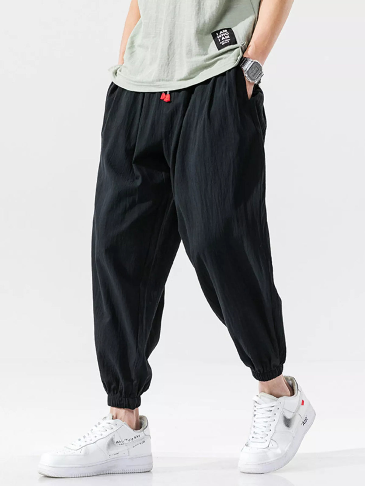 Men's loose fit joggers with a drawstring waist and pockets.