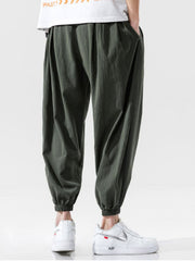 Men's loose fit joggers with a drawstring waist and pockets.