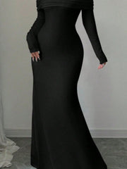Close view of black off shoulder maxi skirt showing the fitted silhouette to the hem