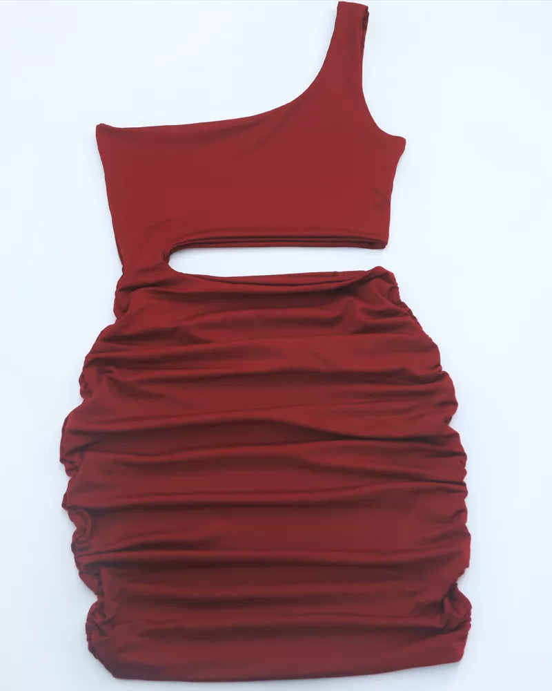 Flat lay view of burgundy one shoulder cutout ruched bodycon mini dress showing the single strap
