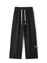 Men's casual loose fit pants with a drawstring waist and pockets.