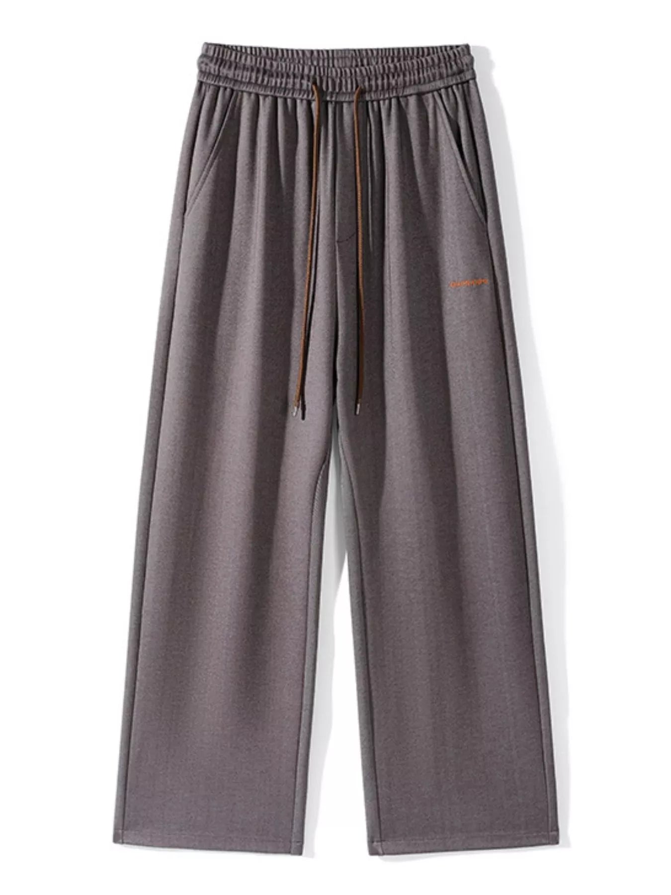 Men's loose fit casual pants with a drawstring waist and pockets.