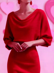 Close view of the red cowl neck and three quarter sleeves on a bodycon midi dress