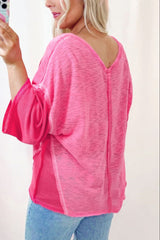 Blusa de manga tres cuartos con escote en V y costuras expuestas