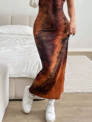 Close lower view of a light brown tie dye bodycon maxi dress skirt