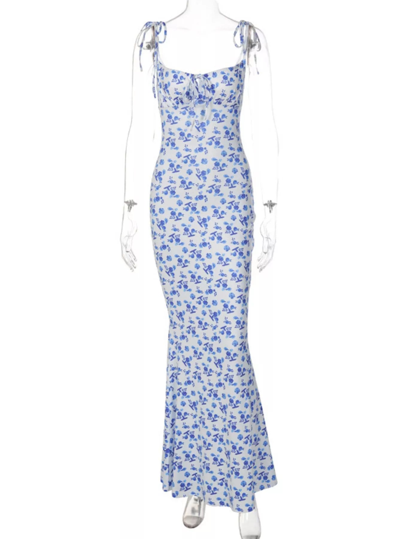 Clear mannequin displaying blue floral print bodycon maxi dress with tie straps on white background