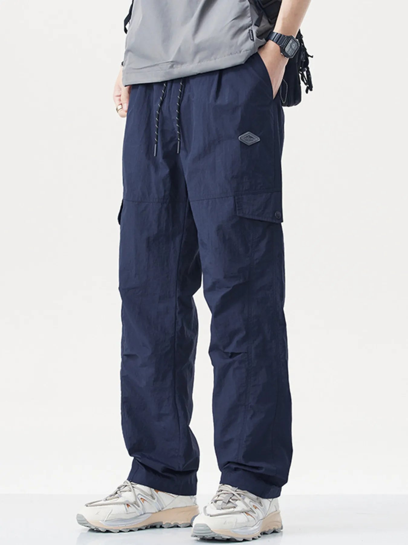 Men's plus size relaxed fit cargo pants with drawstring and pockets, product view.