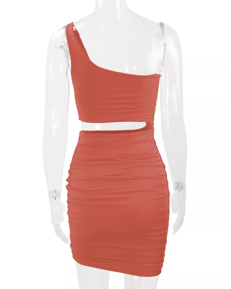 Orange powder one shoulder cutout ruched bodycon mini dress on a clear mannequin back view
