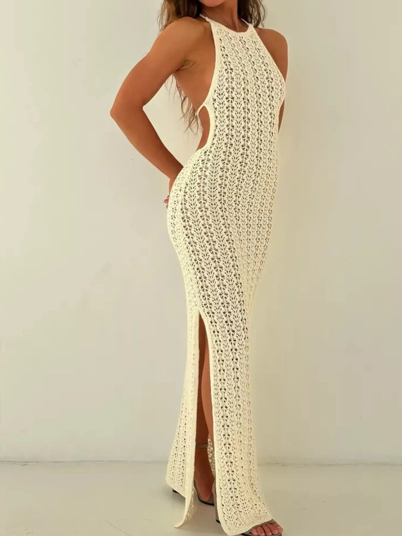 Full side view of beige crochet halter neck bodycon knit cover up dress with slit